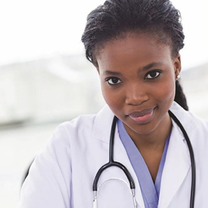 Smiling medical provider with stethoscope around neck