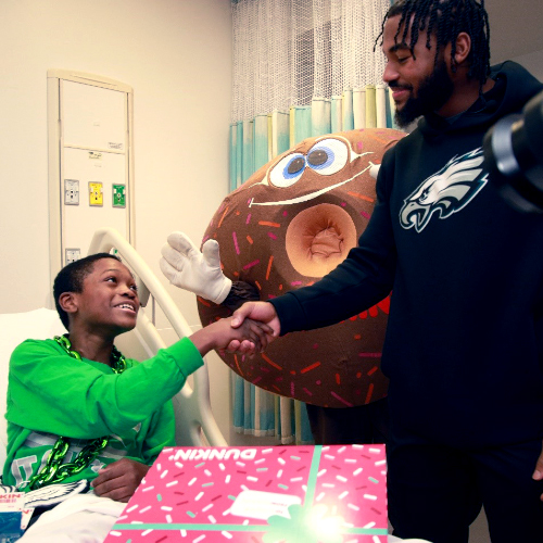 Eagles Running Back D’Andre Swift Surprises patients with donuts, Eagles tickets, team gear and more at St. Christopher's Hospital for Children
