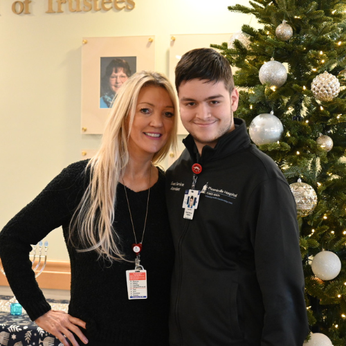 Kathy White and Jack Edwards smile for a photo.
