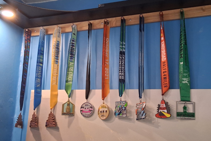 Adam Hughes's participation medals from the Reading Hospital Road Run