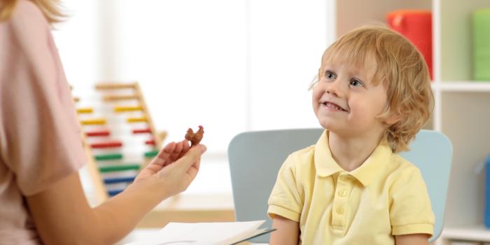 little boy with speech pathologist